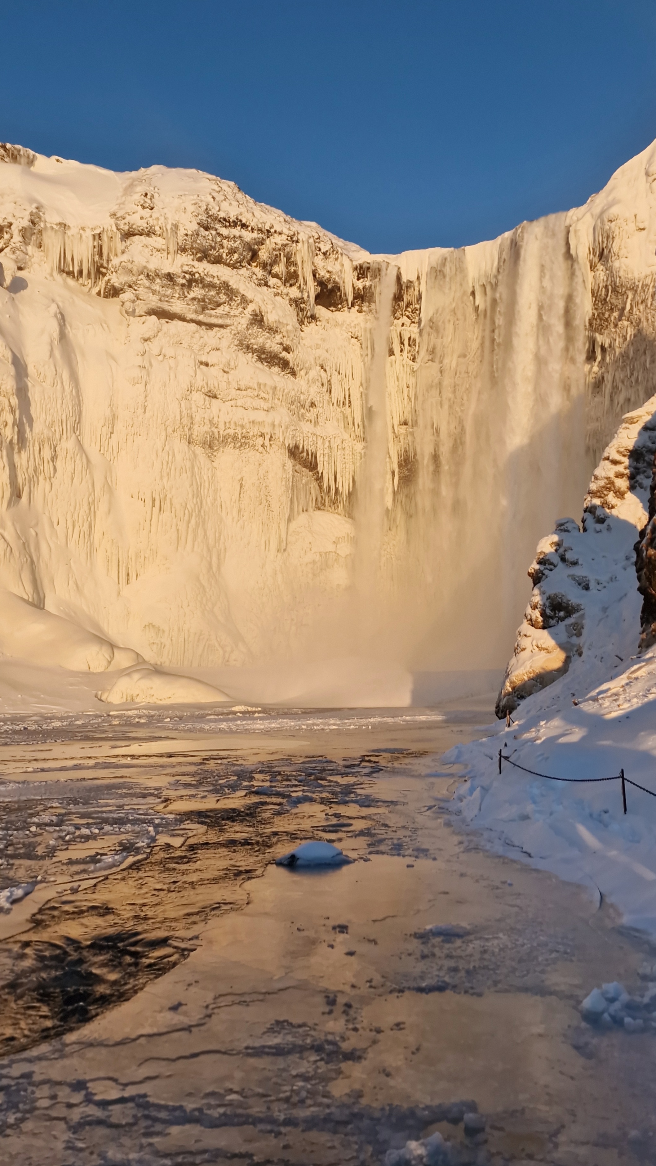An iced over Waterfall capturing some light in the afternoon